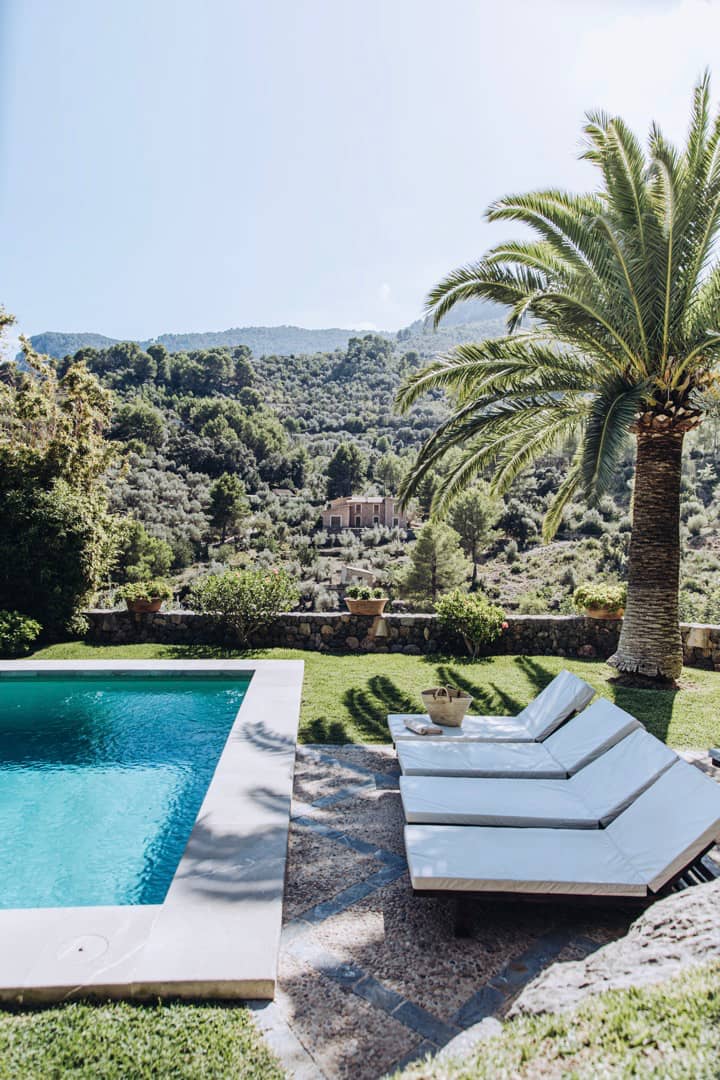 Private pool surrounded by olive trees and mountain views at Villa Es Puig, a luxury villa in Sóller Mallorca.