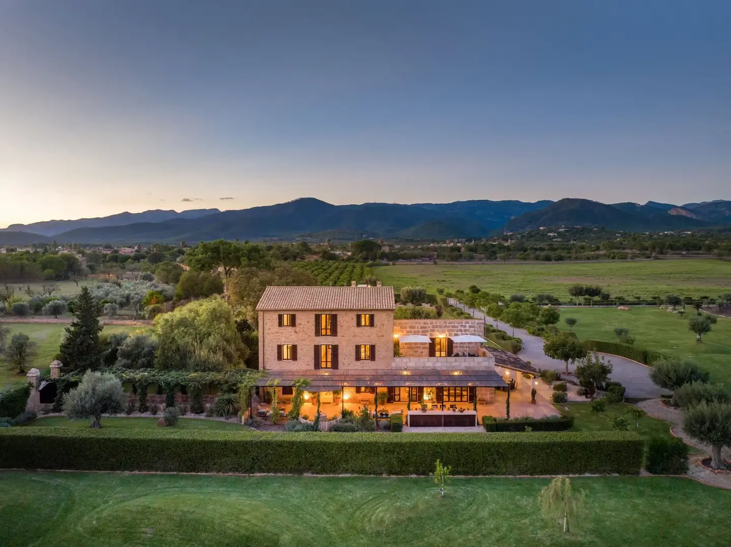 Countryside luxury villa in Mallorca surrounded by a lush Mediterranean garden, offering serene and scenic views.