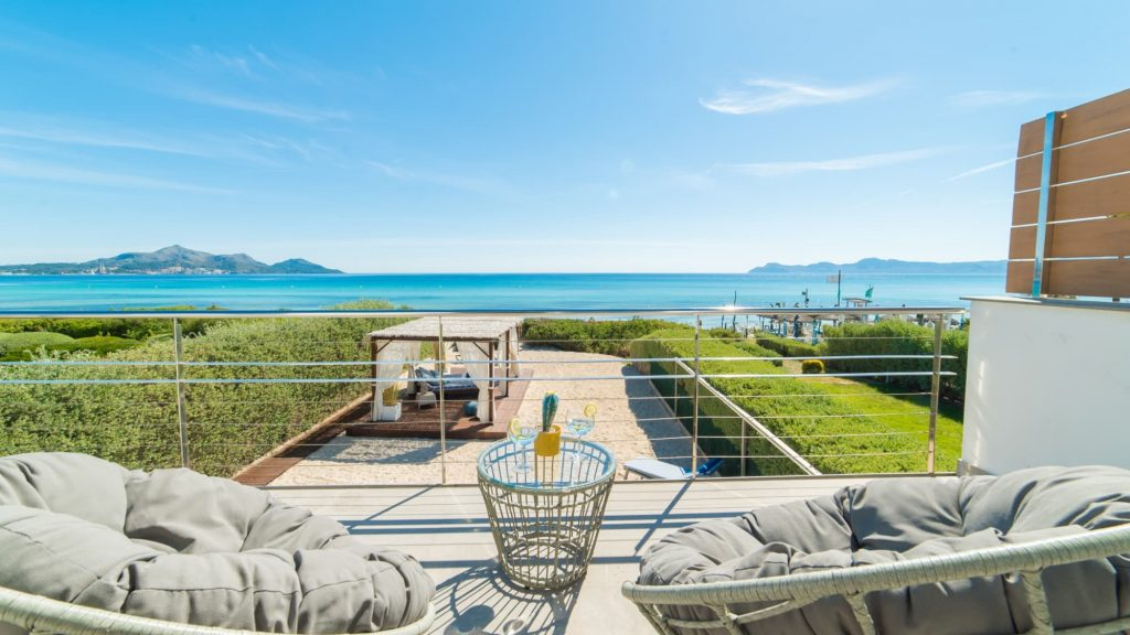 Beachfront family villa in Playa de Muro, Mallorca, with private terrace and panoramic sea views.