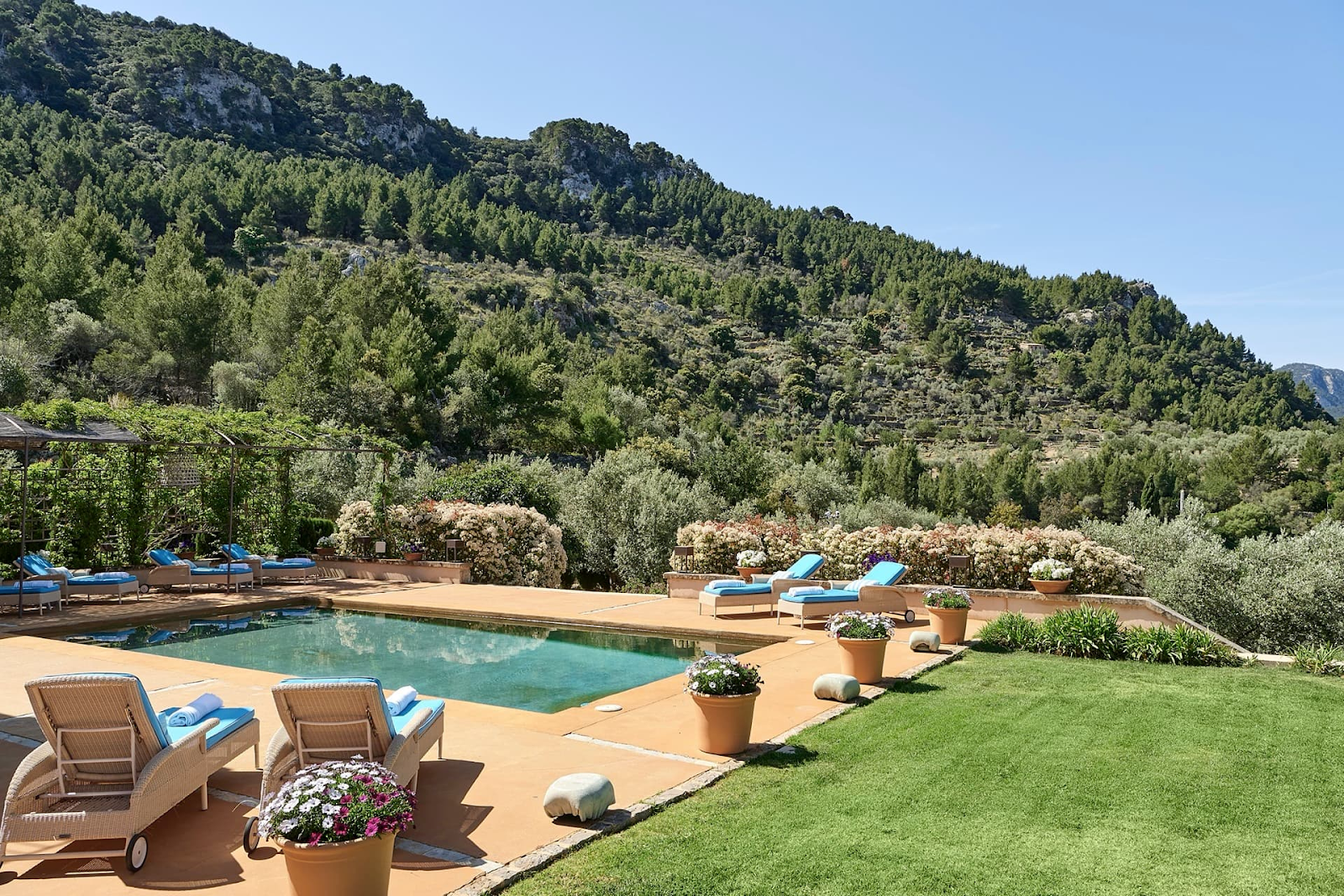 Luxury villa pool in Deià, a village renowned for inspiring artists and writers, set against the Serra de Tramuntana mountains.
