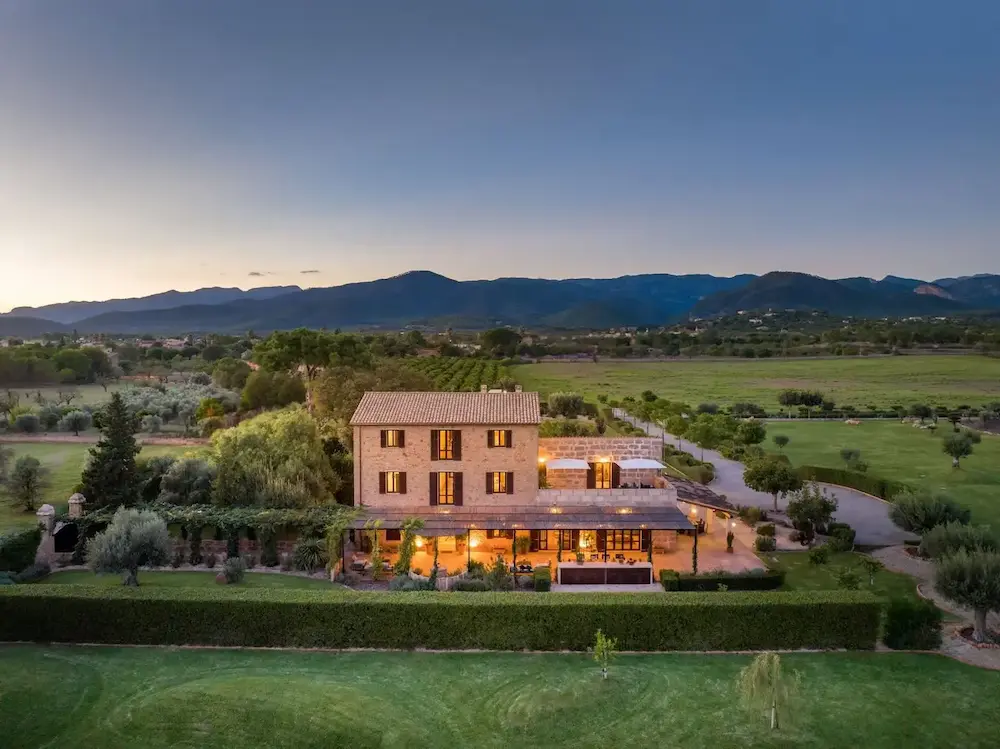 Countryside luxury villa in Mallorca surrounded by a lush Mediterranean garden, offering serene and scenic views.