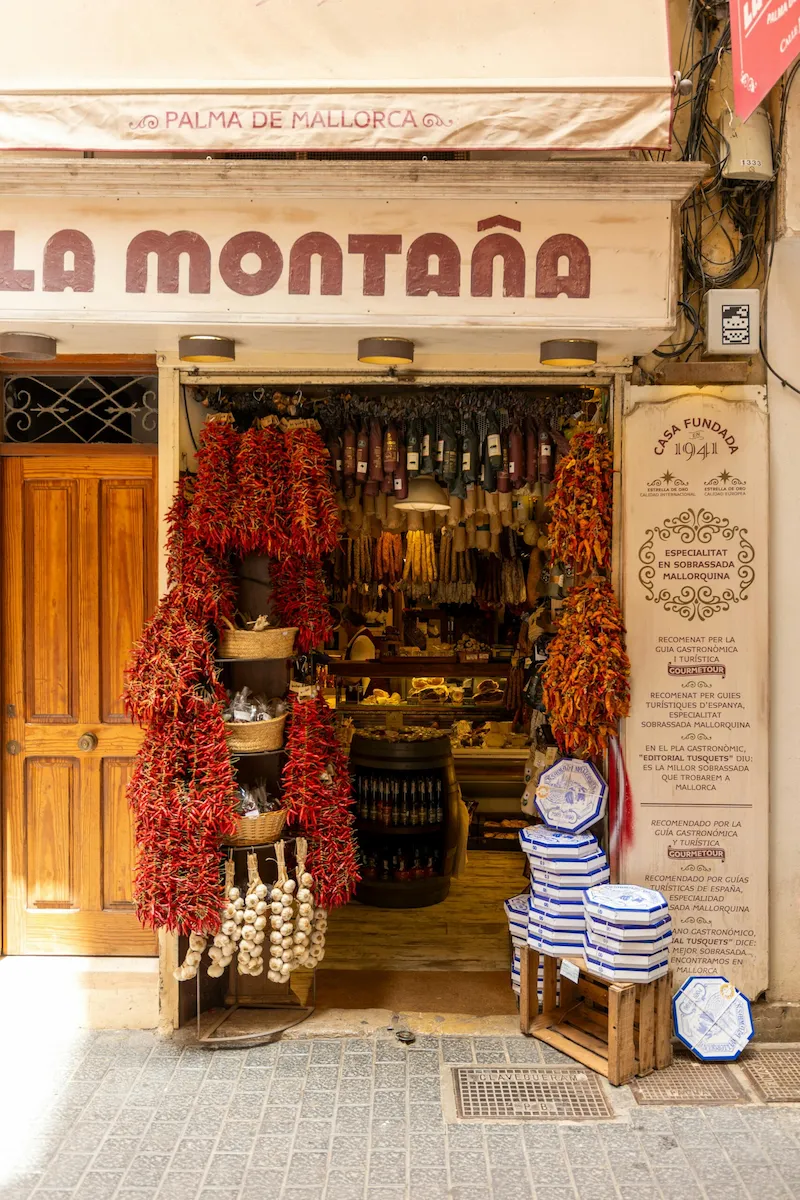 Traditional shop in Palma de Mallorca displaying local produce, reflecting the island’s culinary heritage.