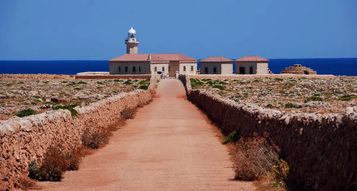 Historic lighthouse in Ciutadella, Menorca overlooking the Mediterranean Sea, a must-see destination near luxury villas in Menorca.