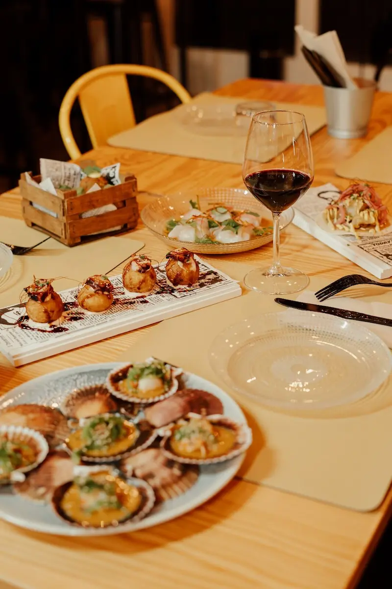 Contemporary dishes and wine served at Restaurante Übeck in Palma, Mallorca, showcasing modern fine dining with local ingredients