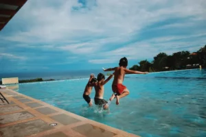 Children playing in a heated pool in Mallorca, highlighting family-friendly villas with heated pools