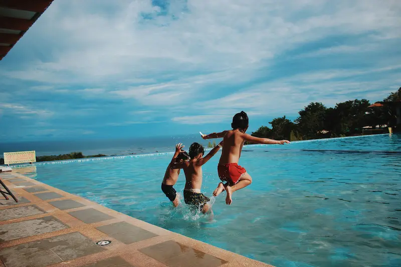 Children playing in a heated pool in Mallorca, highlighting family-friendly villas with heated pools